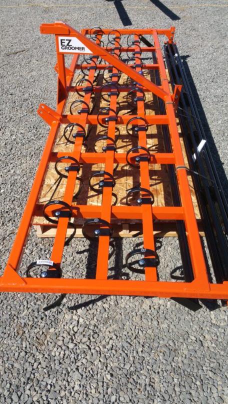 An orange arena drag for a tractor.